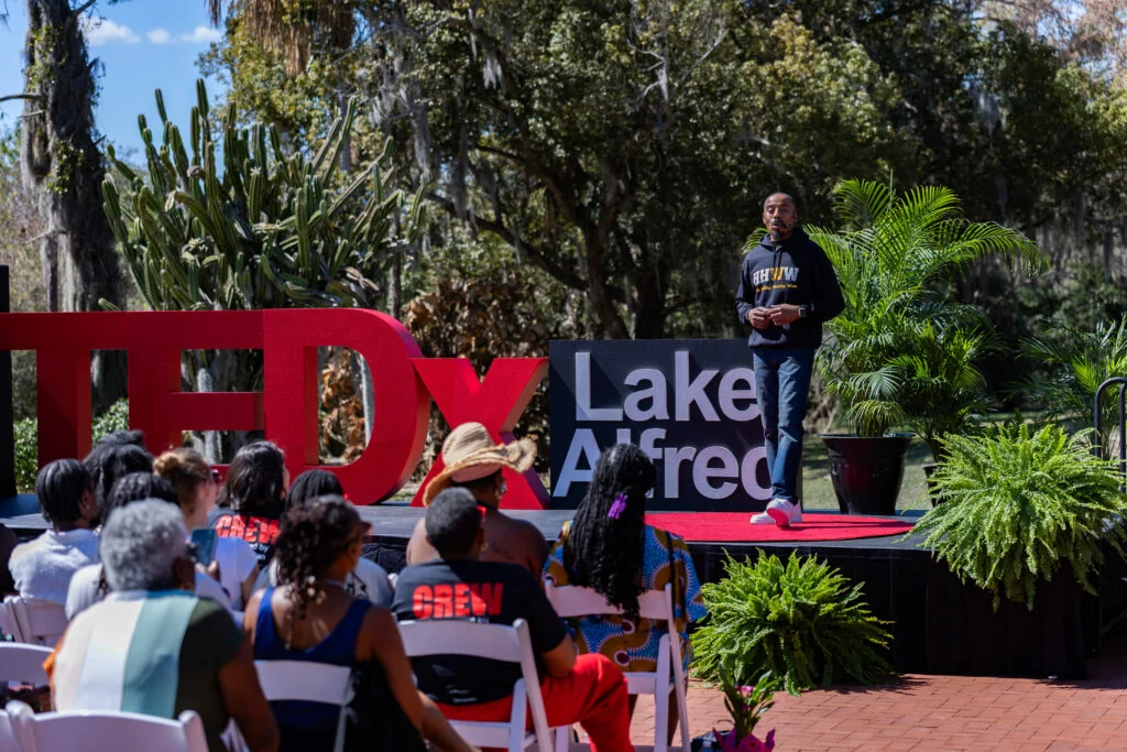 Toni Williams speaking to a live TEDx audience